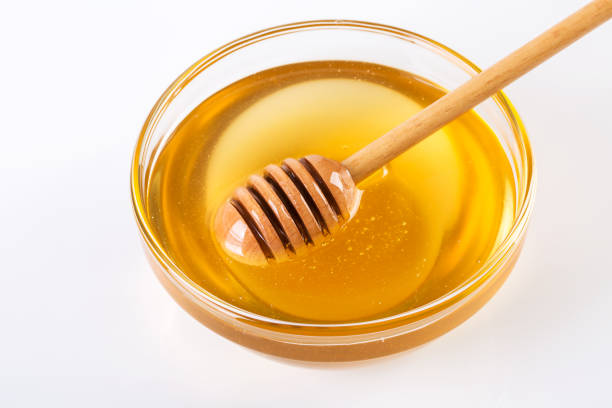 istock Stick with honey isolated on white 1086313764
