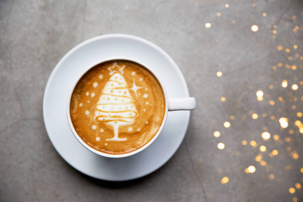 istock Tasty cappuccino with Christmas tree latte art with some blurred lights. 1086315074