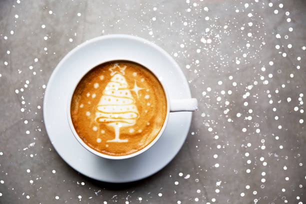 istock Tasty cappuccino with Christmas tree latte art with some blurred lights. 1086315140