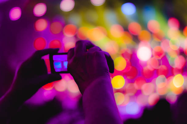 istock removed on the phone at the concert 1086318746