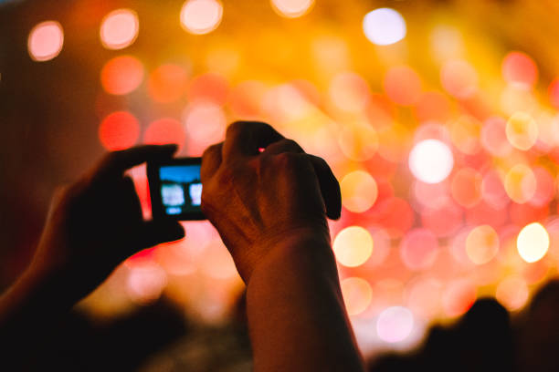 istock removed on the phone at the concert 1086318760