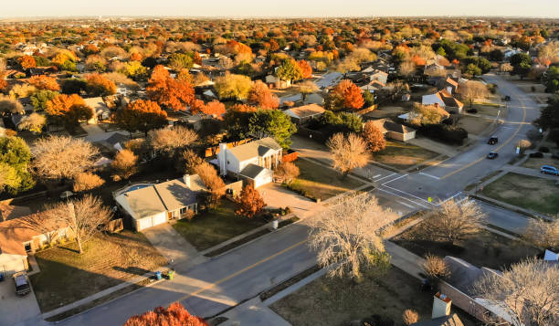 Aerial view residential neighborhood with local street in fall sunset near Dallas stock photo