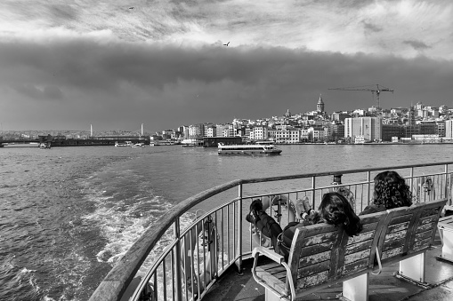 Istanbul, Turkey - Dec 21, 2018: People are getting on the ferry boat in Eminonu. Every day nearly 150,000 passengers use ferries in Istanbul.