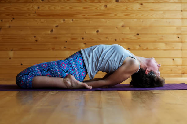 istock Caucasian woman is practicing yoga at studio 1086326608
