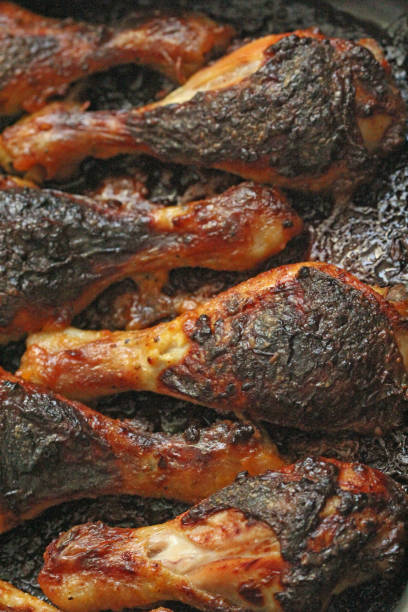 istock Grilled chicken legs with spices and garlic. Crispy fried chicken. Top view 1086327270