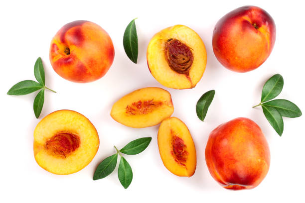 istock ripe nectarine with leaves isolated on white background. Top view. Flat lay pattern 1086334162
