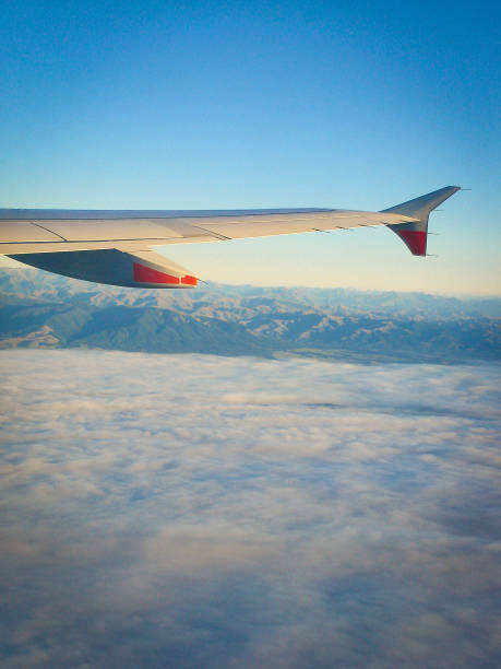 Over the clouds looking down over the mountains of New Zealand