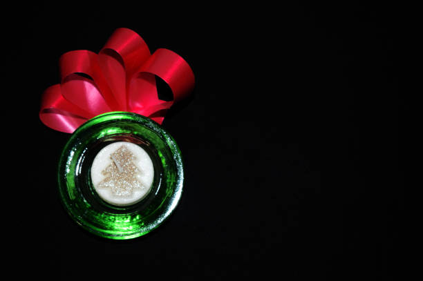 Decorative glass candle holder with candle.