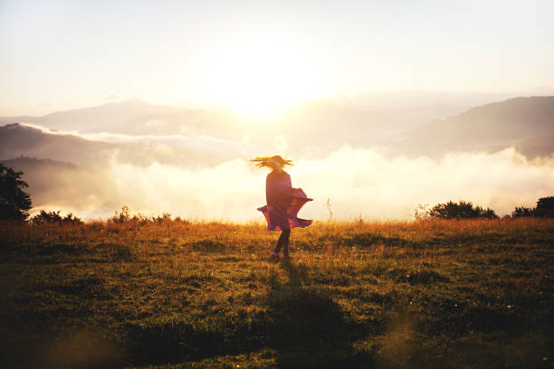 istock Pretty Young Girl Dancing in Mountains 1086336632