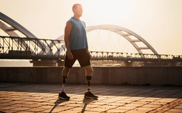 istock Man with the prosthetic leg taking a walk along river 1086340872