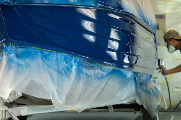 istock spray gun with paint for painting a boat 1086341442