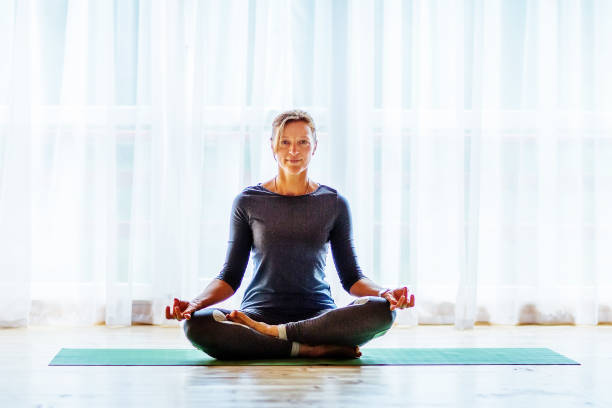 istock Caucasian woman is practicing yoga at studio 1086343608
