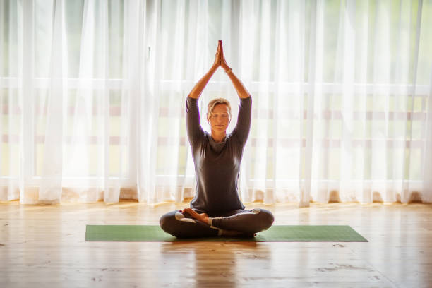 istock Caucasian woman is practicing yoga at studio 1086343636
