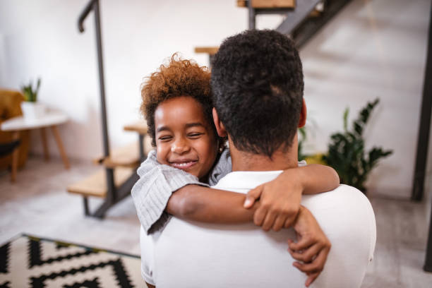 istock Happy daughter hugging father at home. 1086346782