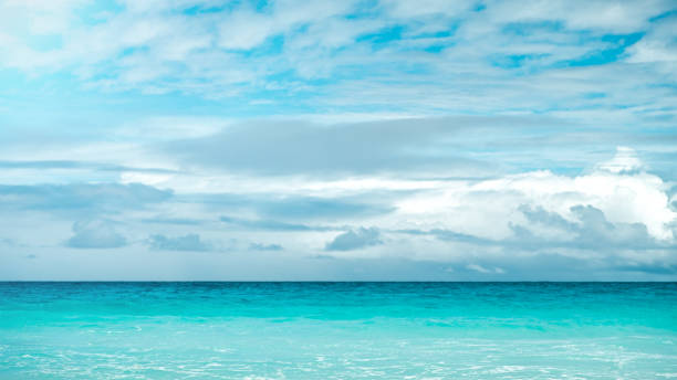 istock blue sea and cloudy sky over it 1086350190