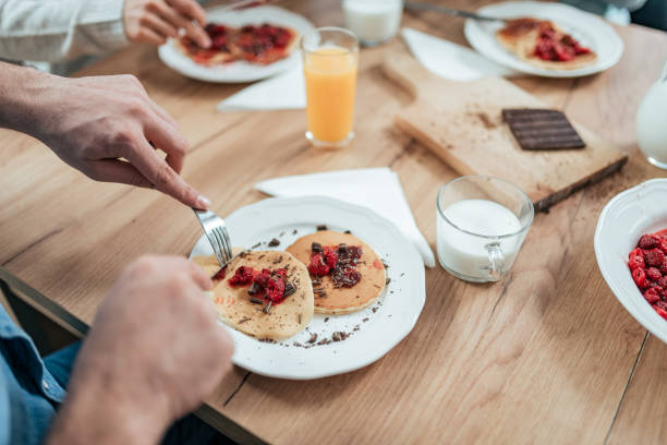 istock Eating homemade pancakes, close-up. 1086350498