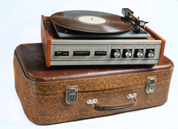 istock Vinyl player on an old leather suitcase isolated on a white background