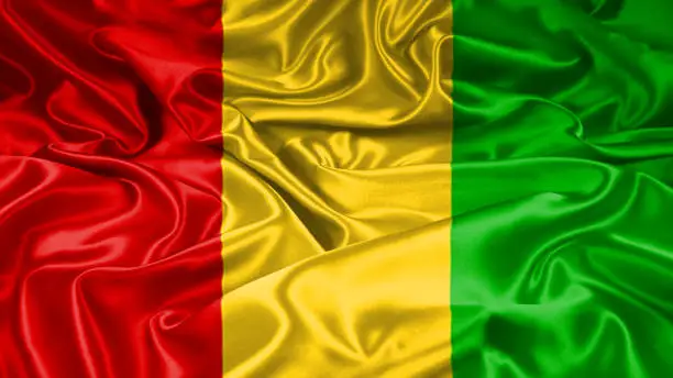 Photo of Guinea flag on silk and satin texture with mask