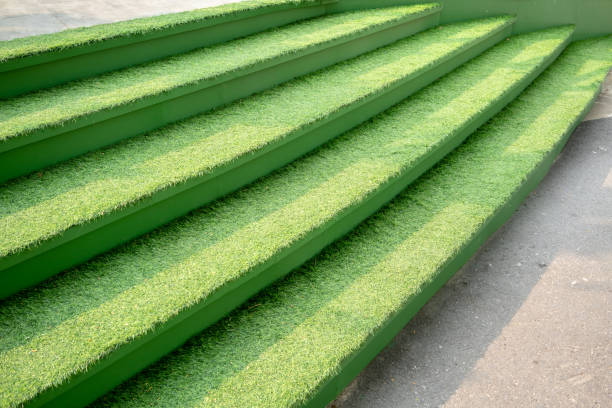 istock Artificial green grass on concrete stairs for nature theme  decoration concept. 1086356206