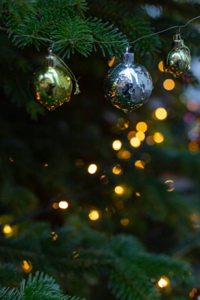 istock glossy christmas balls on tree at market in advent 1086356504