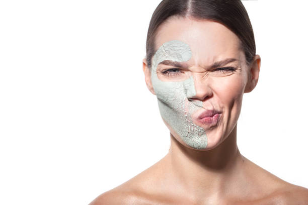 dried blue clay on the beautiful woman's face