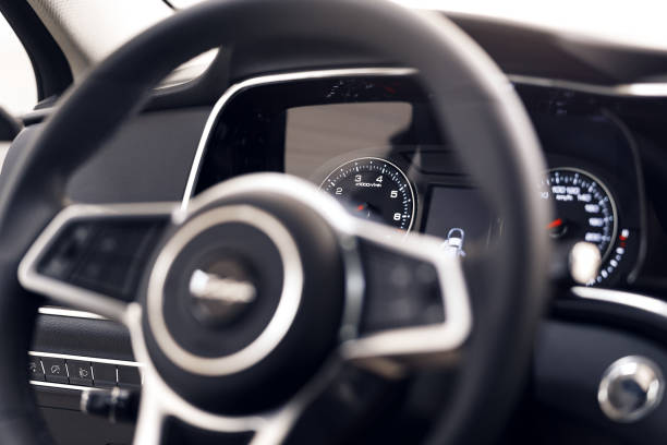 istock Close-up of a modern dashboard in an expensive car. The steering wheel is blurred. Advanced technology concept 1086363400