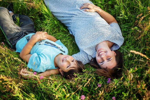 istock mother and child are having fun in the mountains 1086370414
