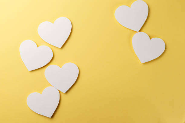 istock Valentine's Day postcard. Valentine's Day Background. Hearts on yellow background. Copy space. Top view. Flat lay 1086370630