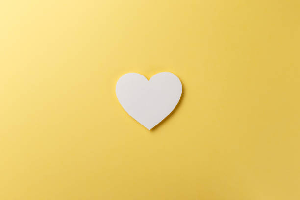 istock Valentine's Day postcard. Valentine's Day Background. Heart on yellow background. Copy space. Top view. Flat lay 1086372096