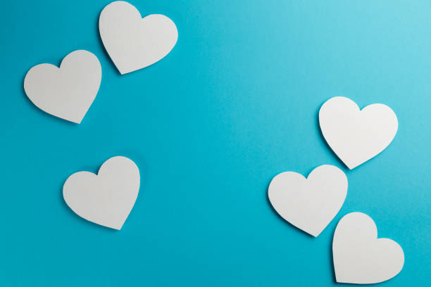istock Valentine's Day postcard. Valentine's Day Background. Hearts on blue background. Copy space. Top view. Flat lay. Pastel colors 1086372194
