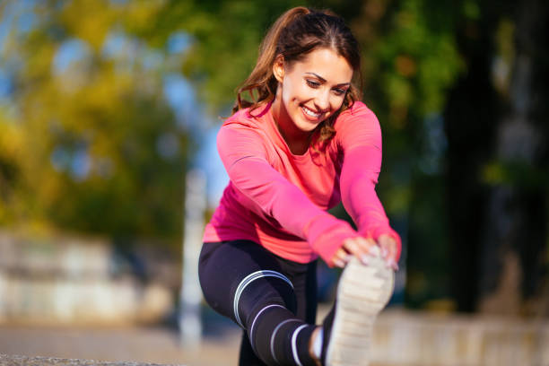 istock Sportswoman stretching leg before morning run 1086372298