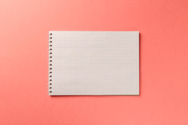 istock Blank notebook on Coral background. Top view. Flat lay. Copy space. Colorful background. Living Coral color of the Year 2019 1086372348