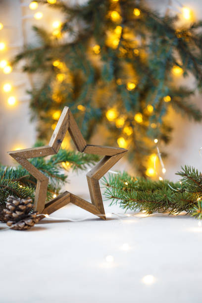 istock Christmas star, fir branches, new year decorations, notepad on a light background 1086372606