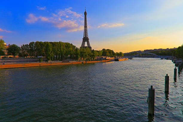 istock Eiffel Tower from Seine river shore at dramatic sunrise – Paris, France 1086372768