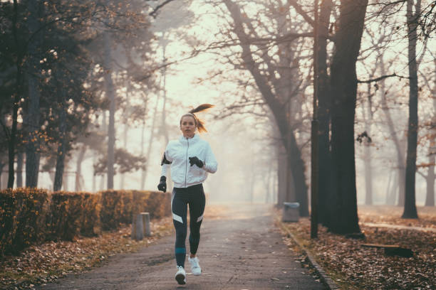 istock Woman jogging during winter morning 1086374480