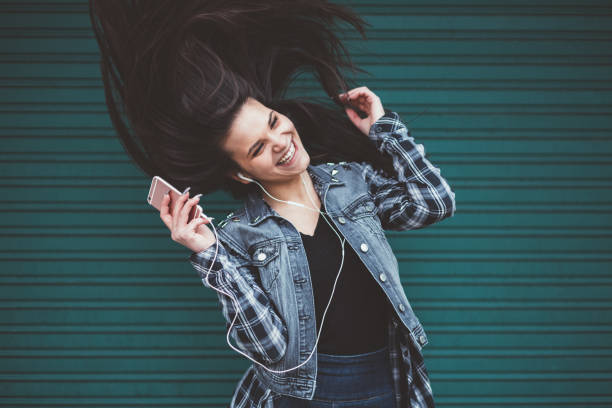 istock Happy girl dancing 1086374504