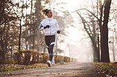 Woman jogging during winter morning