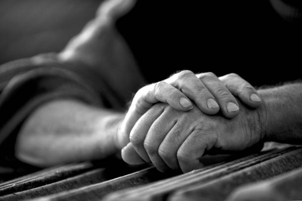 istock hands of an old man , black and white 1086374776