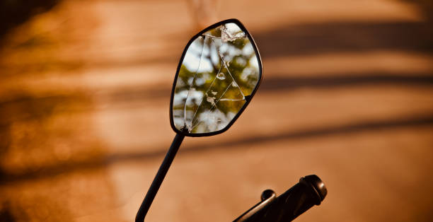 A broken looking mirror of a bike A broken looking mirror of a bike isolated unique photo broken side view mirror stock pictures, royalty-free photos & images