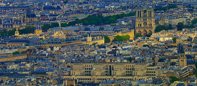 Notre Dame Cathedral and French roofs architecture from above at sunset – Paris, France