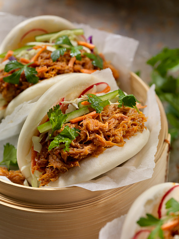 Steamed Bao Buns with Pulled Pork with Carrots, Coleslaw and Cilantro with a Savory Sauce