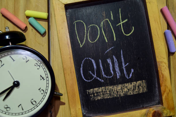 istock Don't Quit on phrase colorful handwritten on chalkboard 1086376728