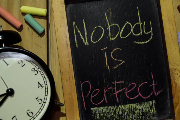 istock Nobody is Perfect on phrase colorful handwritten on chalkboard 1086376742