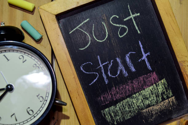 istock Just Start on phrase colorful handwritten on chalkboard 1086377776