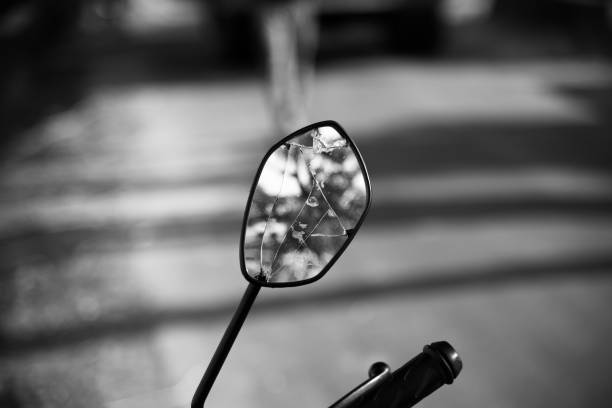 A broken looking mirror of a bike A broken looking mirror of a bike isolated object unique photo broken side view mirror stock pictures, royalty-free photos & images