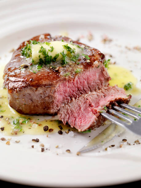 istock Medium Rare Fillet Mignon Steak with Herb Garlic Butter 1086379404
