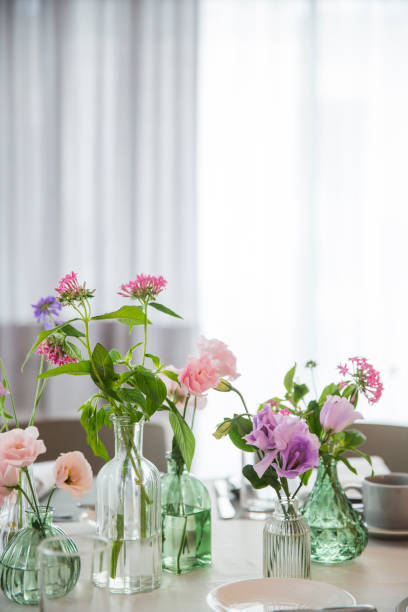 istock Party table decorated with beautiful flowers 1086381186