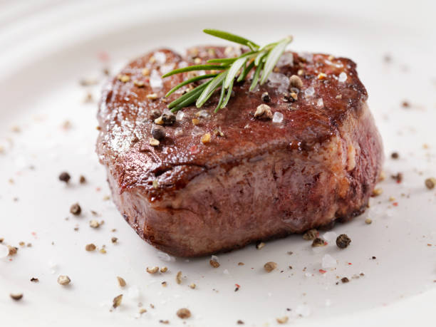 medium rare fillet mignon steak with herb garlic butter - fat portion studio shot close up imagens e fotografias de stock