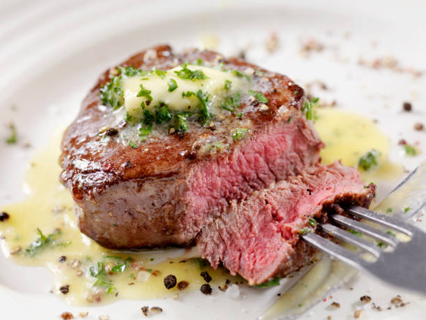 istock Medium Rare Fillet Mignon Steak with Herb Garlic Butter 1086386594
