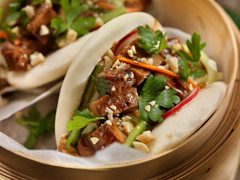 Pork Belly Bao Buns with Carrots, Coleslaw and Cilantro with a Savory Sauce